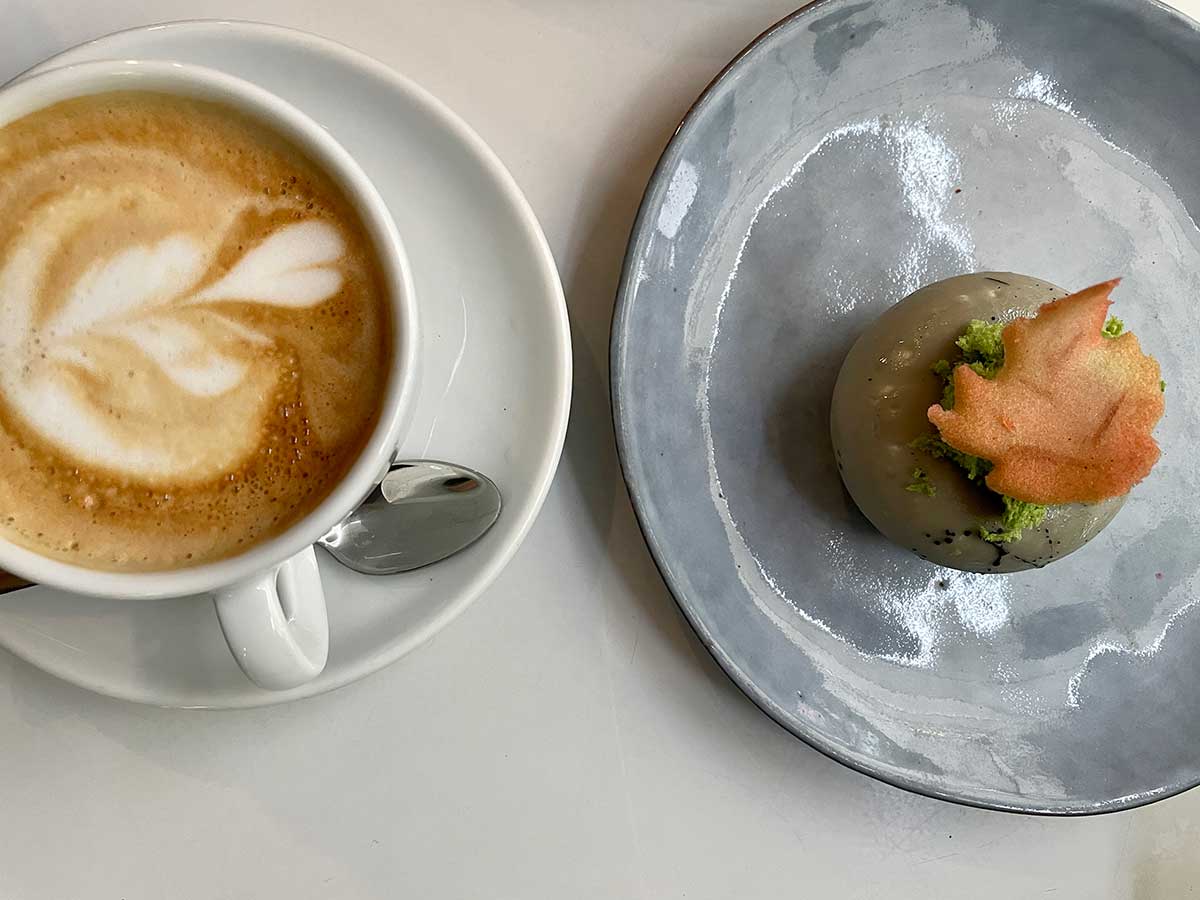 A cappuccino and a pastry in a tea shop in Strasbourg