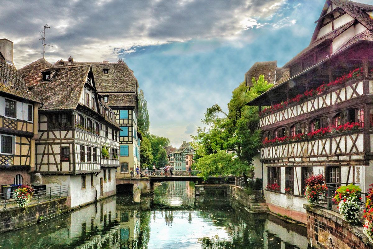 Water under a bridge and half-timbered houses in La Petite France