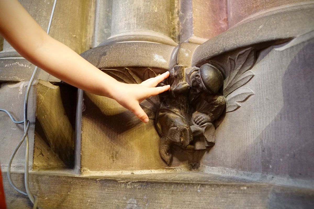 hand on a statue in the strasbourg cathedral