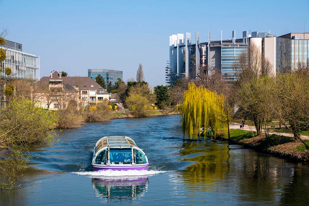 Boat in the River Ill in front of the European Parliament