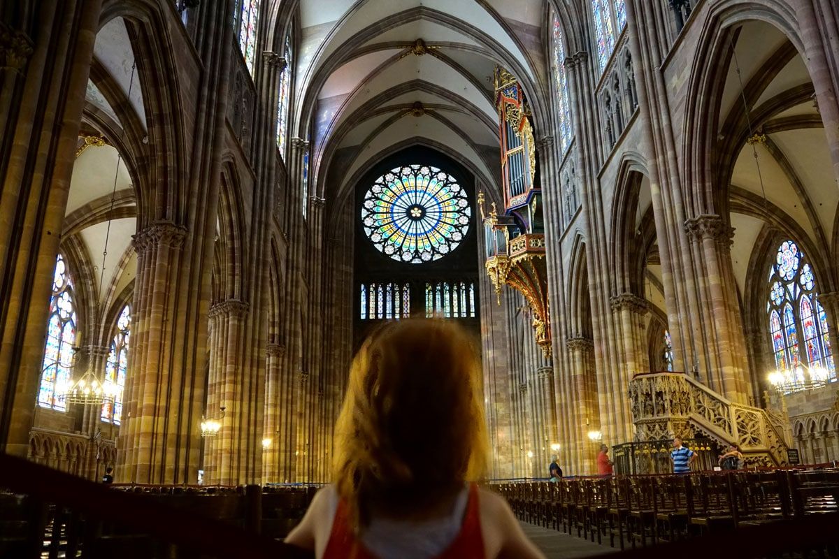 Kid in Strasbourg's Notre-Dame Cathedral